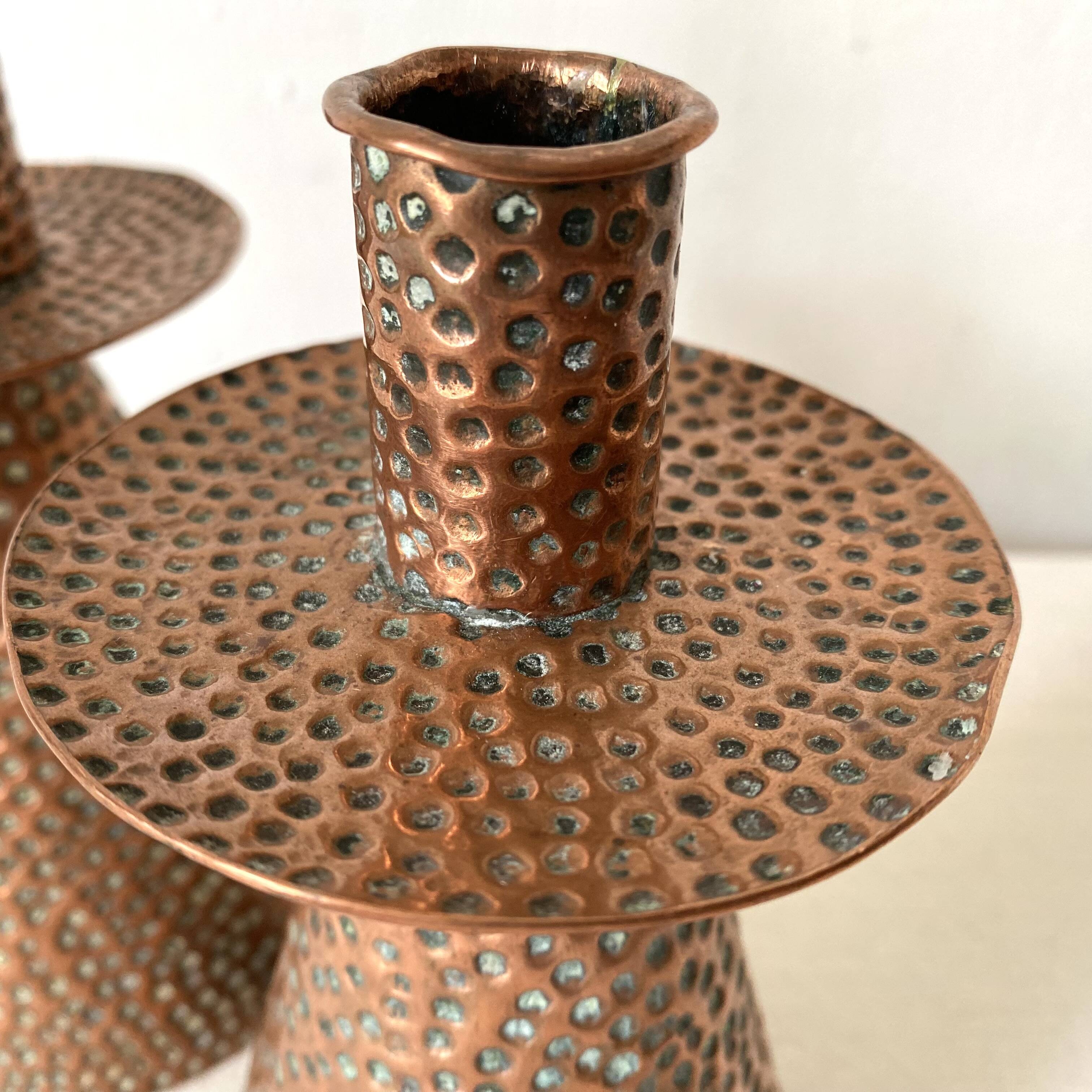 Pair of hammered copper candlesticks from the 1950s