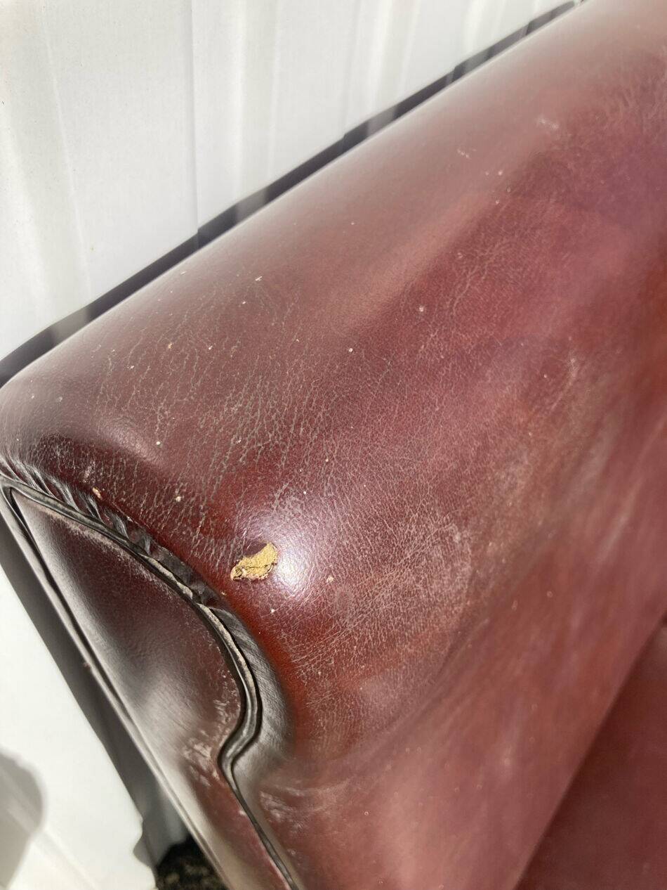 Three-seater patinated leather sofa, mid-century style.