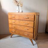 Vintage chest of drawers with checkerboard and compass feet