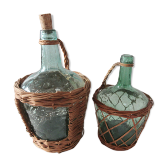 Duo of green glass and wicker canisters