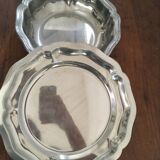 Two matching round dishes in stainless steel