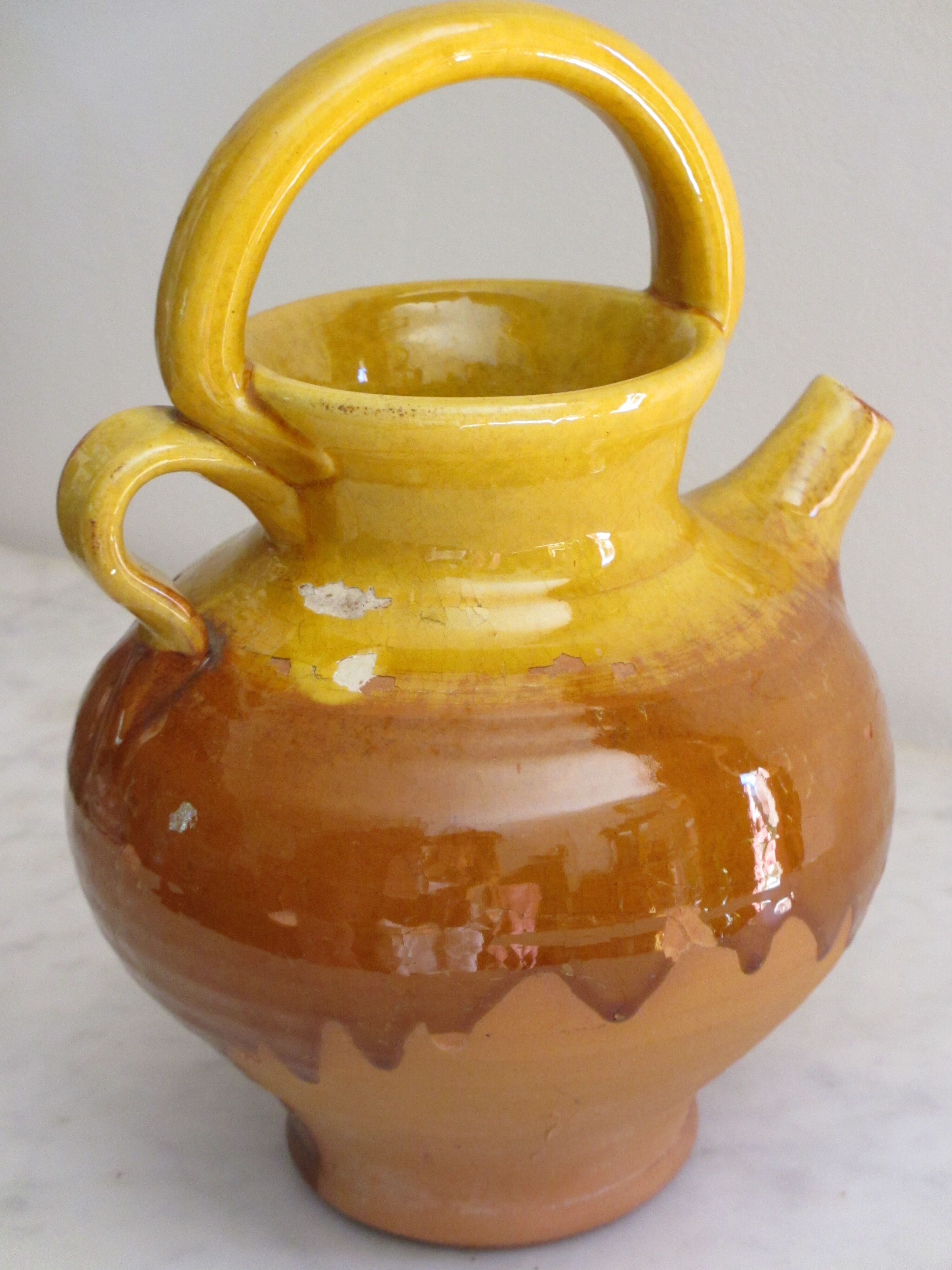 E-mailed terracotta jug or kid.