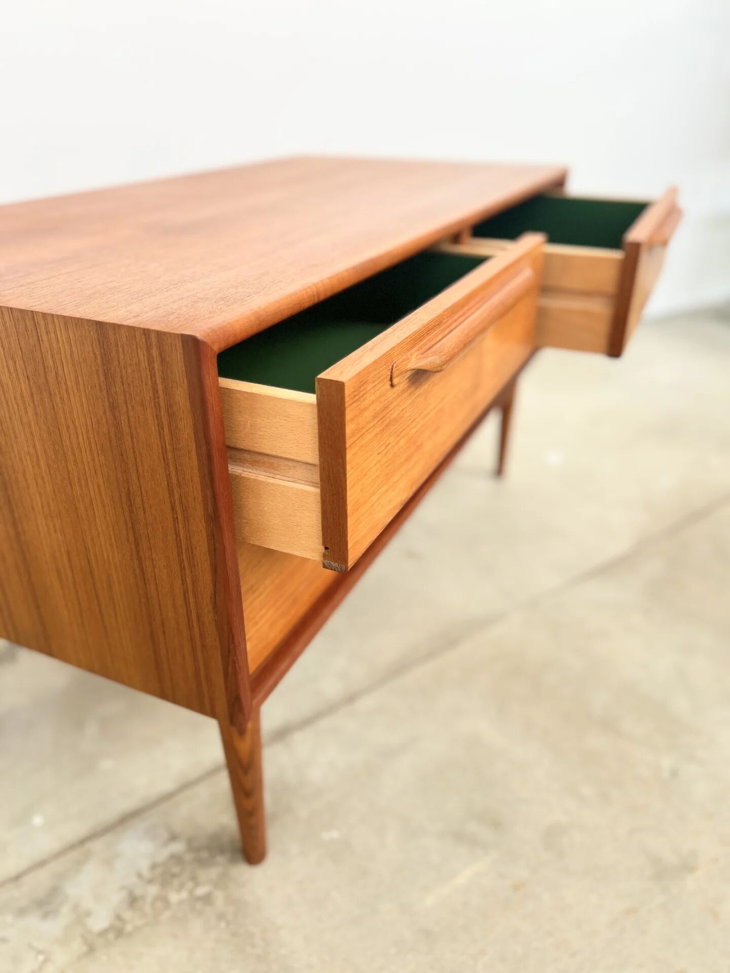 Lowboard teak 4 drawers — Mid-century lines, tapered legs, 1960s