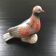 Antique bird in pearly ceramic