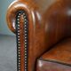Club armchair in sheepskin with black piping