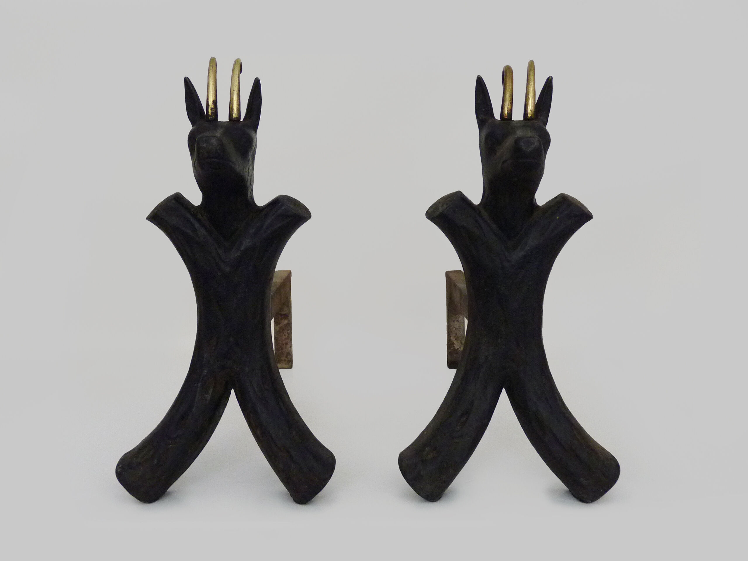 Pair of zoomorphic cast iron chimney pegs representing Isards. 50s