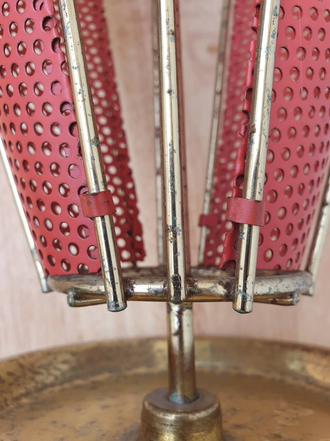 Perforated metal umbrella stand and scoubidou