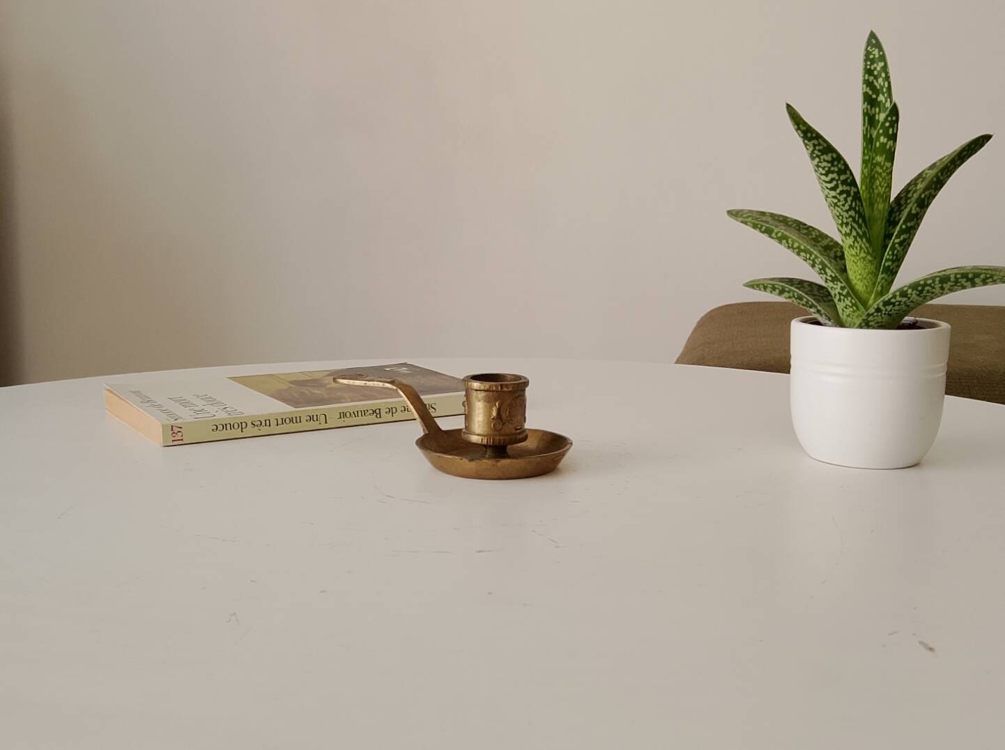 Antique hand-held candlestick in gilded bronze
