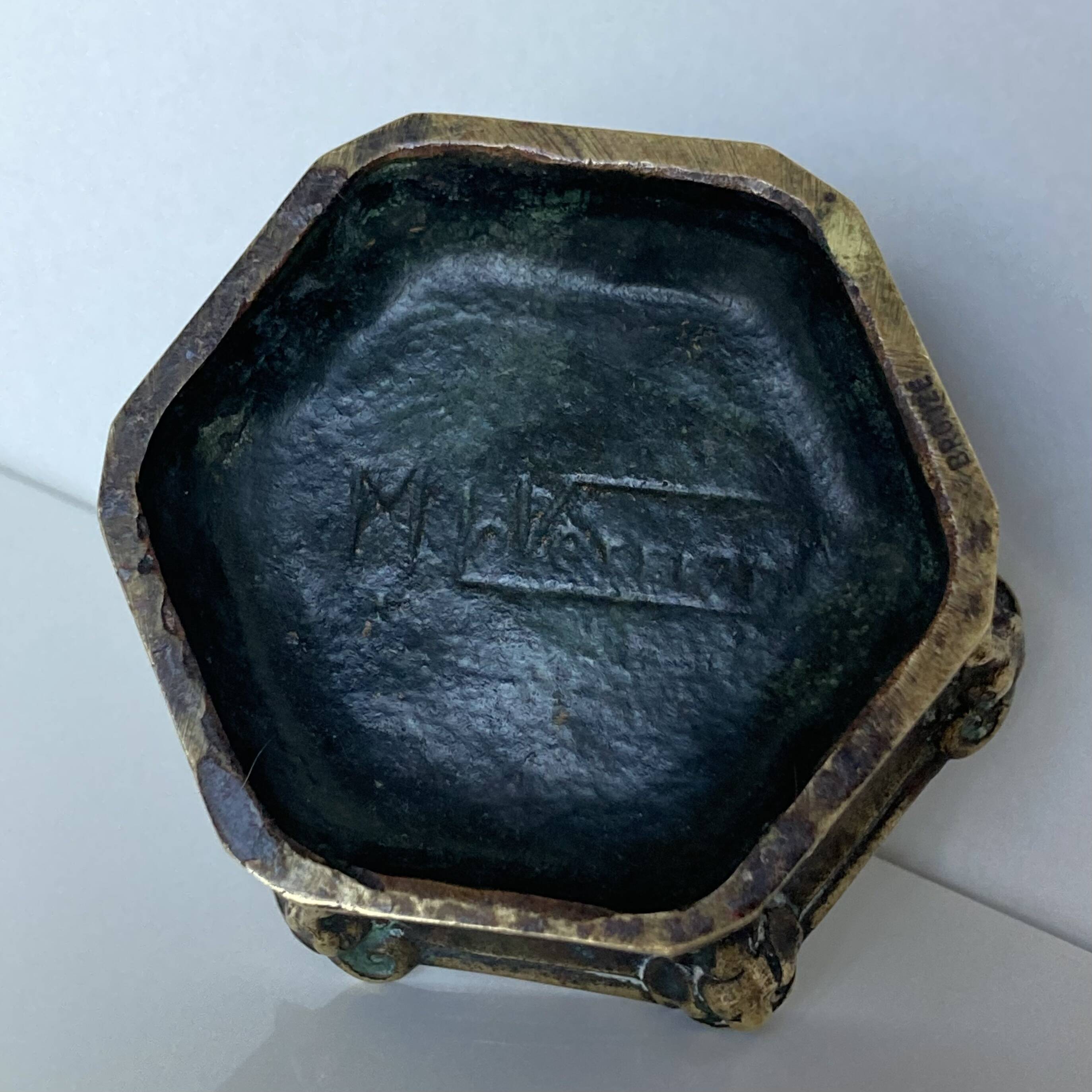 Gothic style bronze ashtray in the shape of a well with heraldic motifs by Max Le Verrier