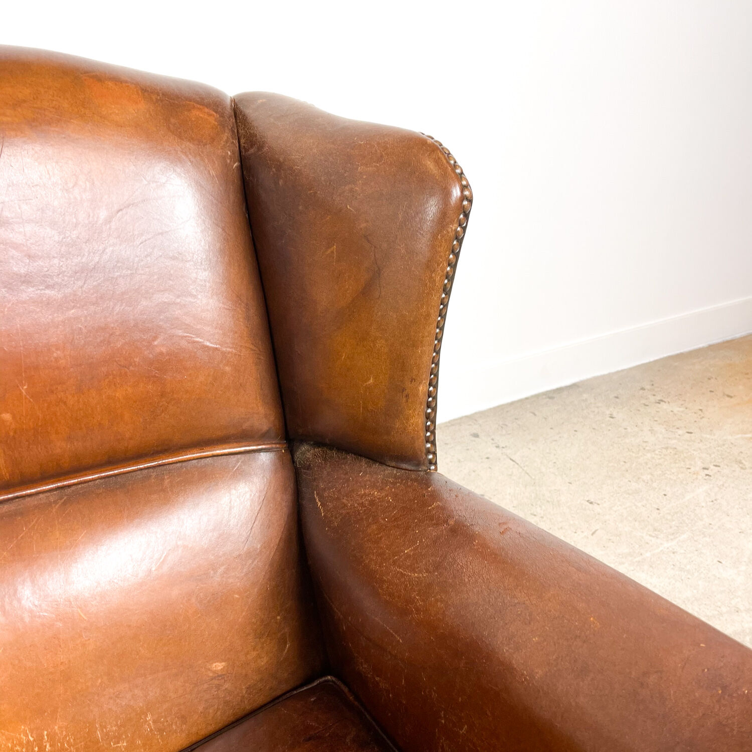 Dark brown sheep leather wingback armchair vintage