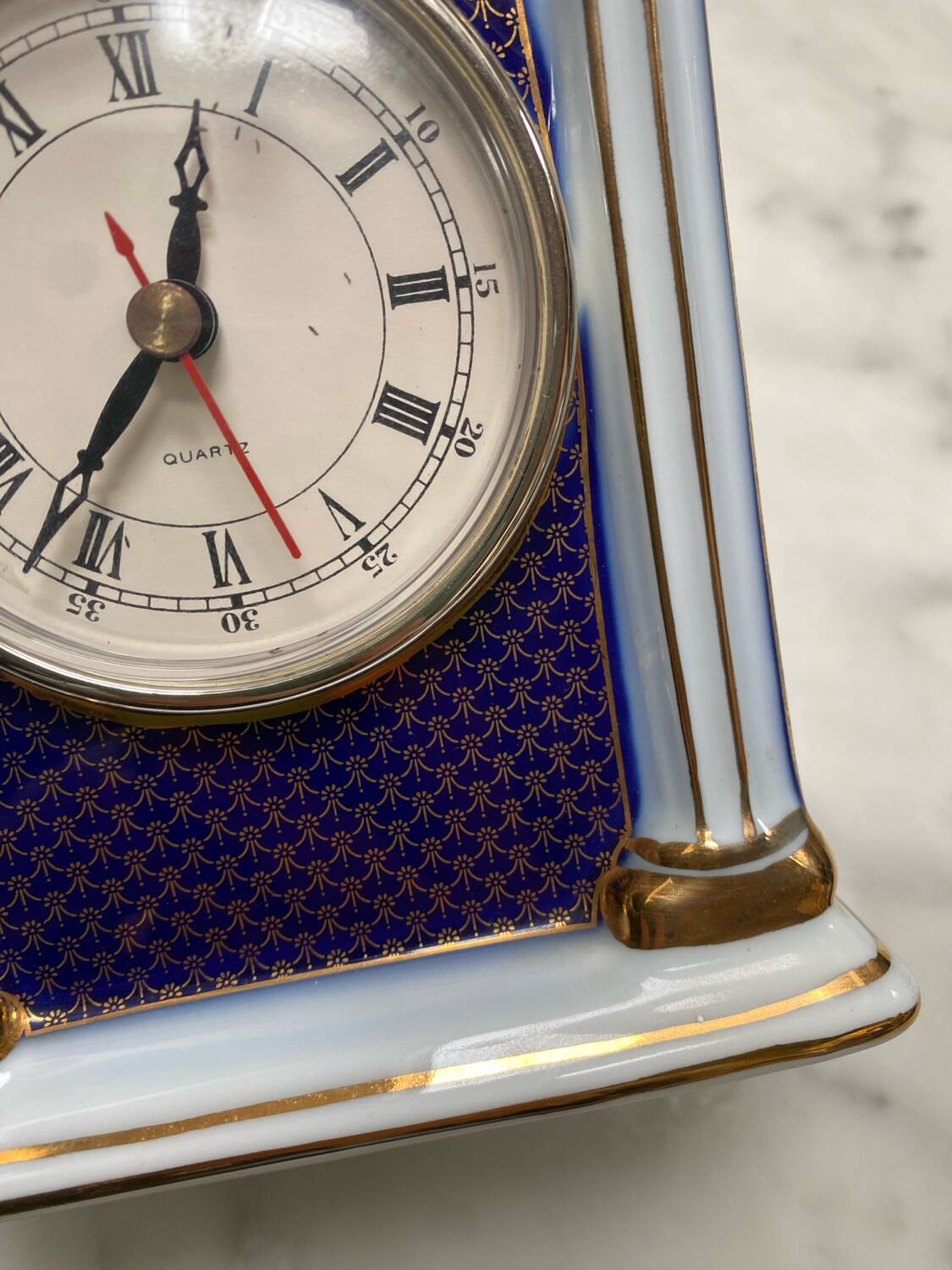 English porcelain clock and candle holders