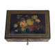 Old black wooden box adorned with roses with keys