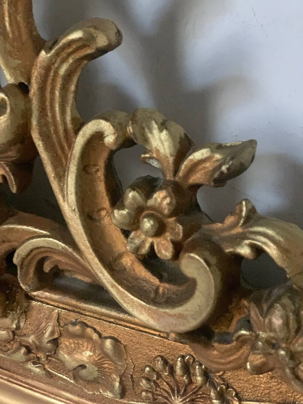 Gilded fireplace mirror with pediment