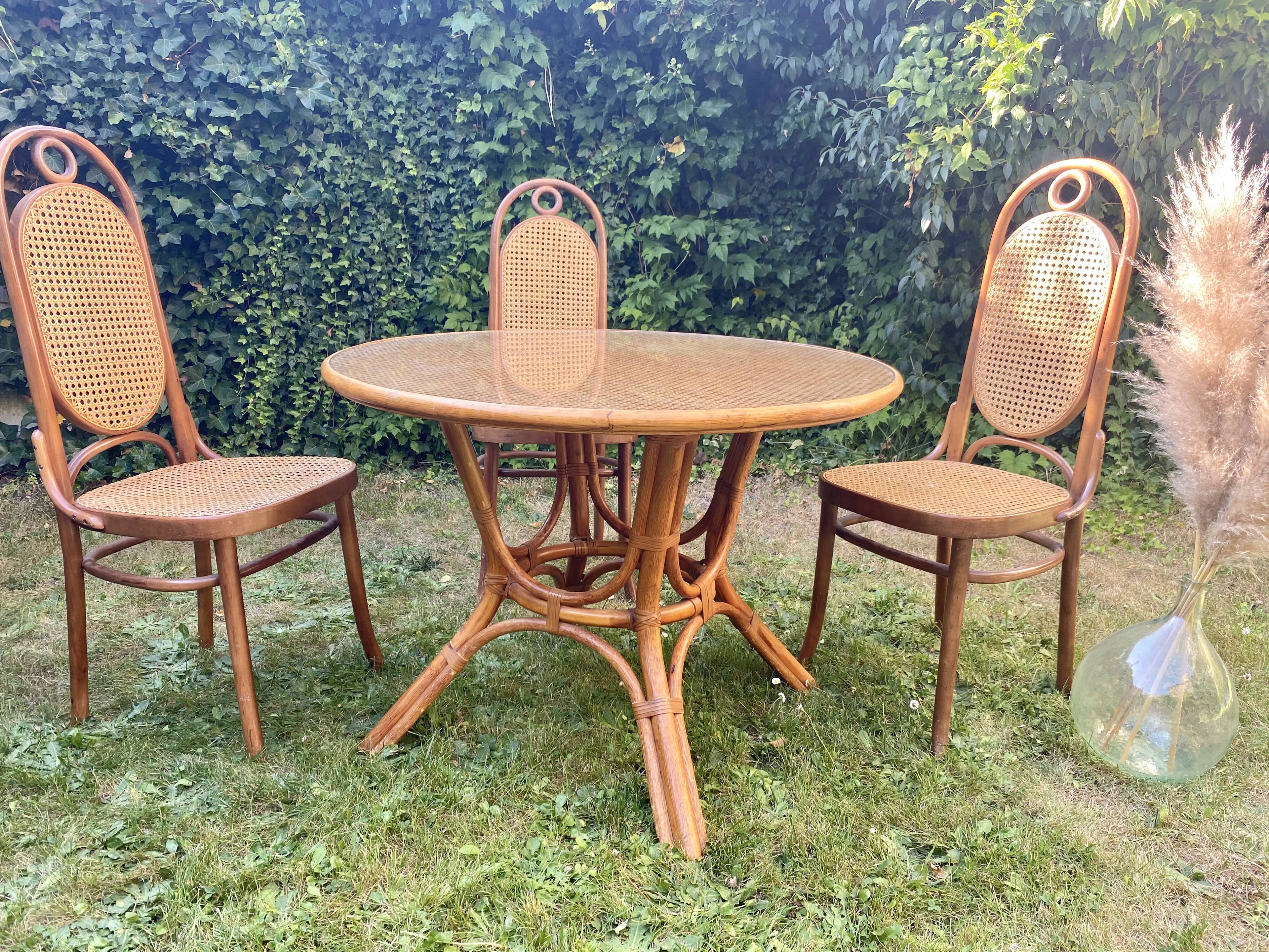 Canned rattan dining table and vintage glass