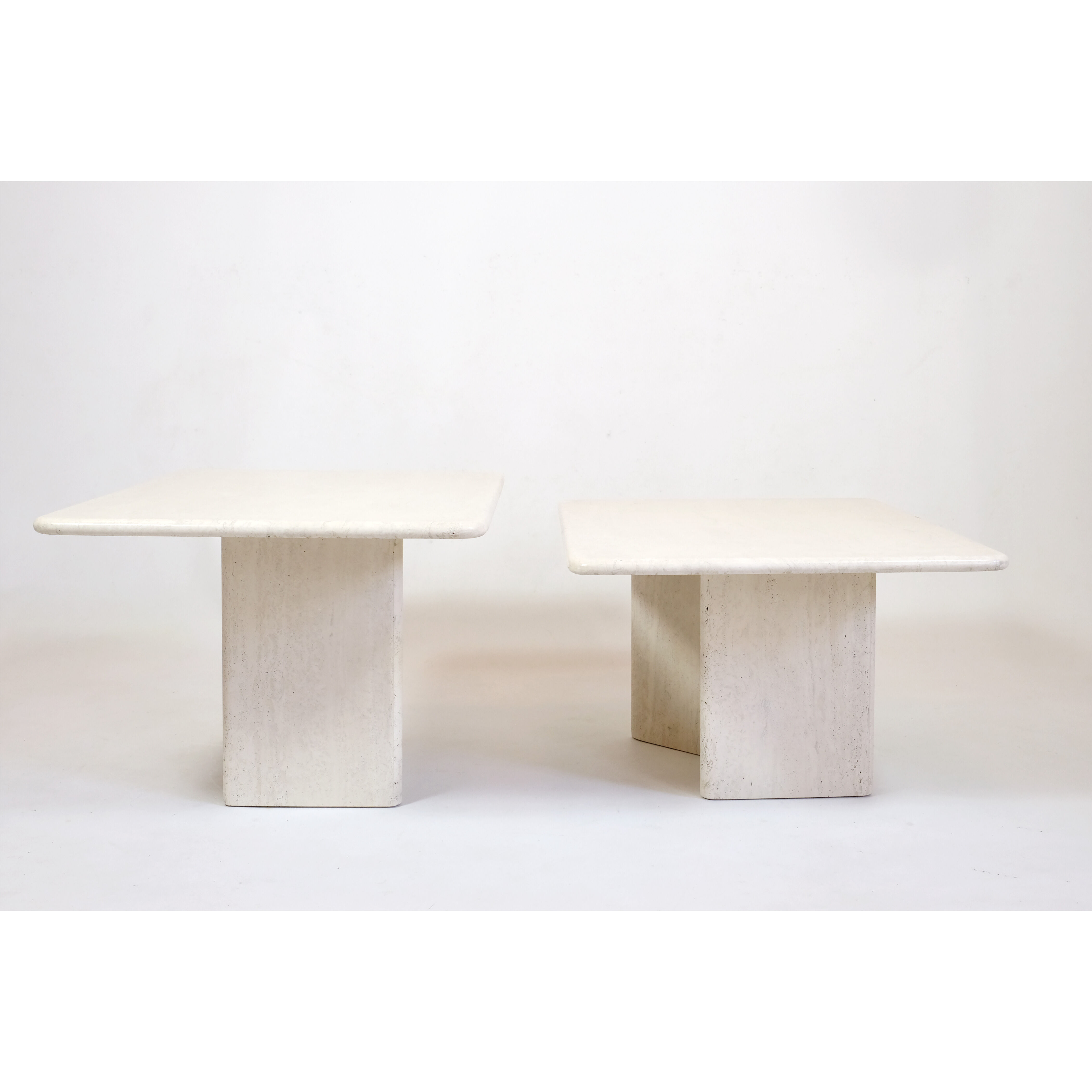 Pair of travertine trundle tables, Italy