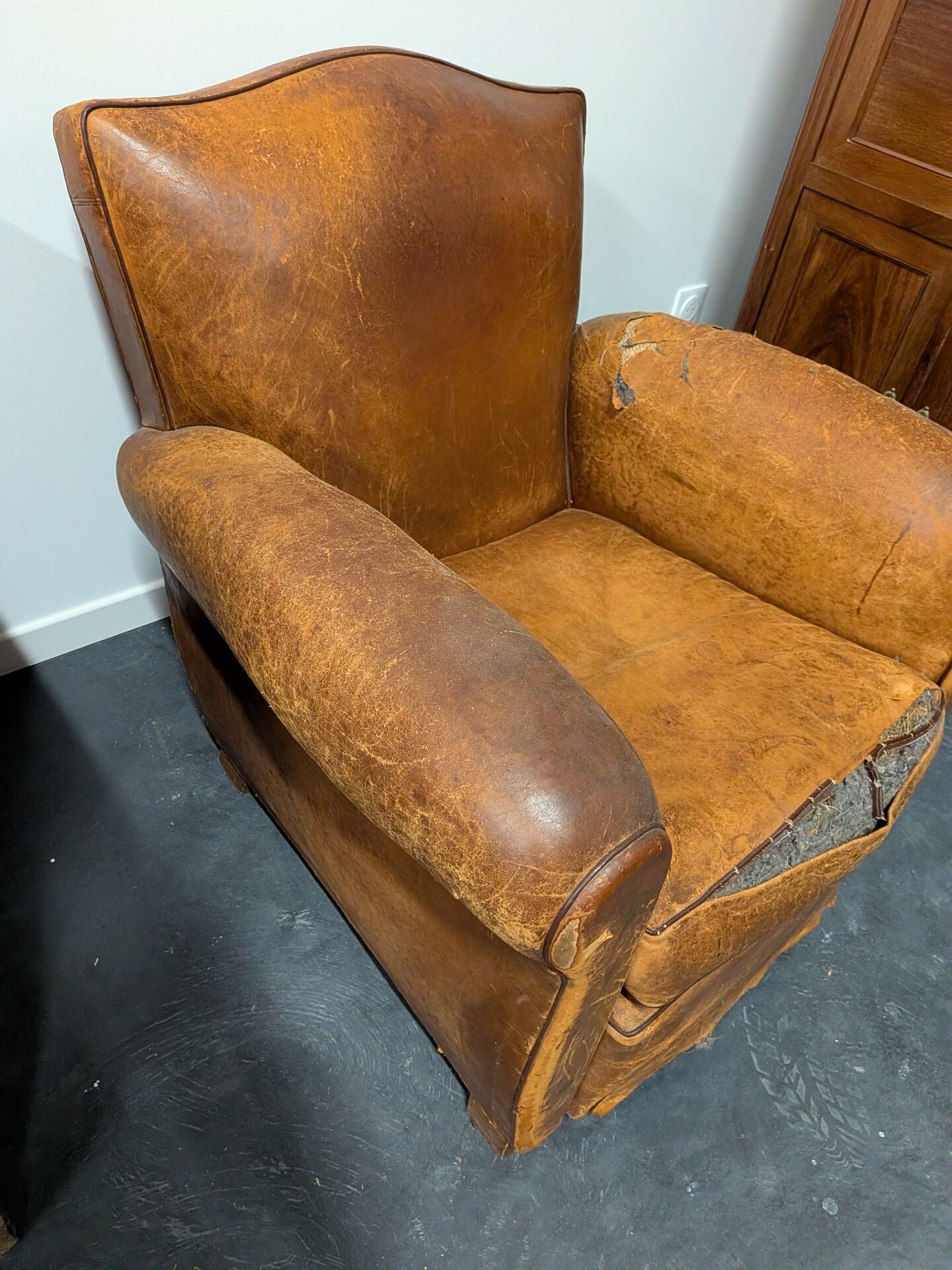 Pair of moustache club armchairs in leather, France, 1930s — to be restored.