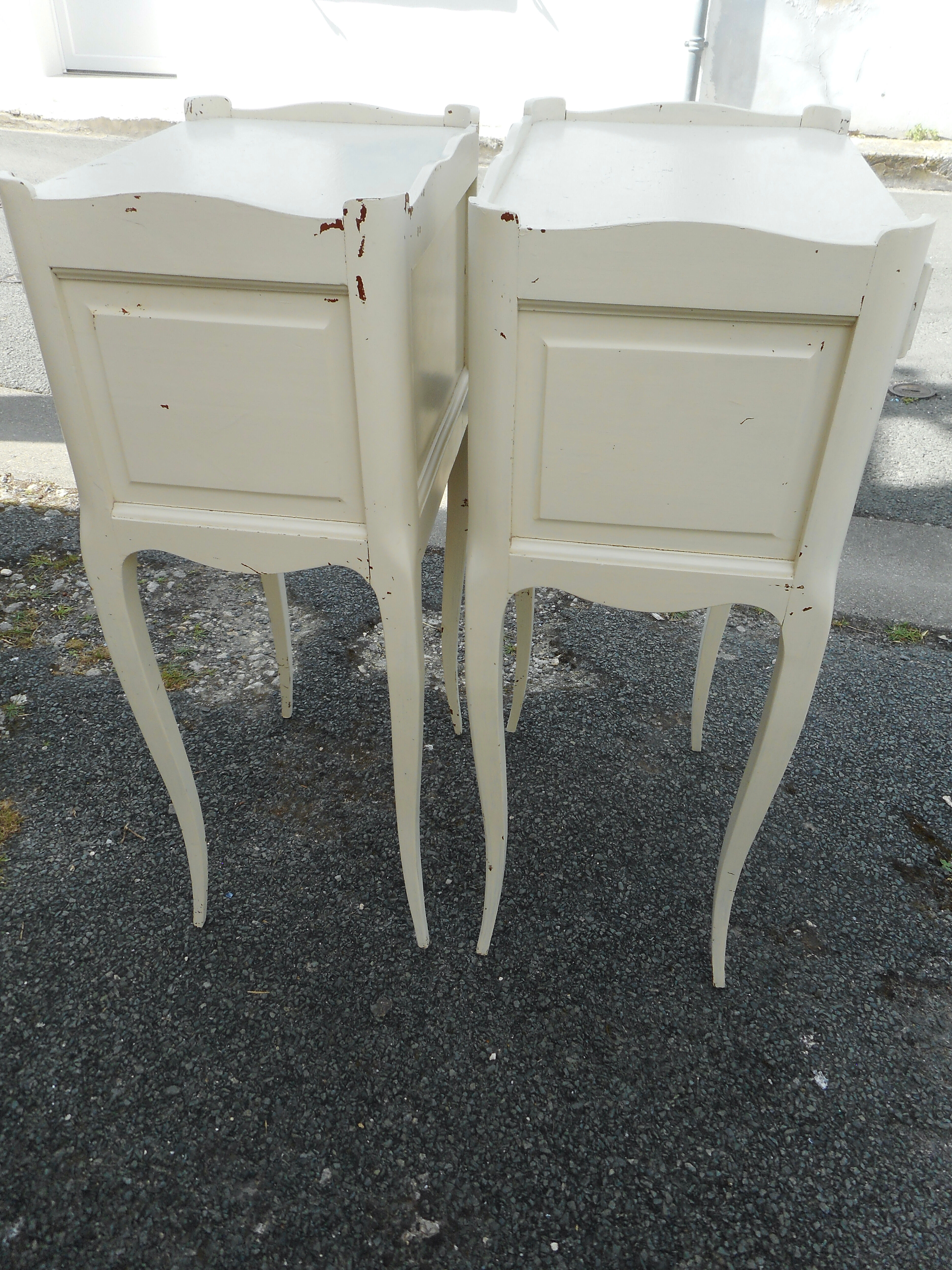 Pair of white lacquered bedside tables