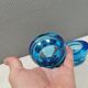A set of iitalla candle holders in blue transparent glass.