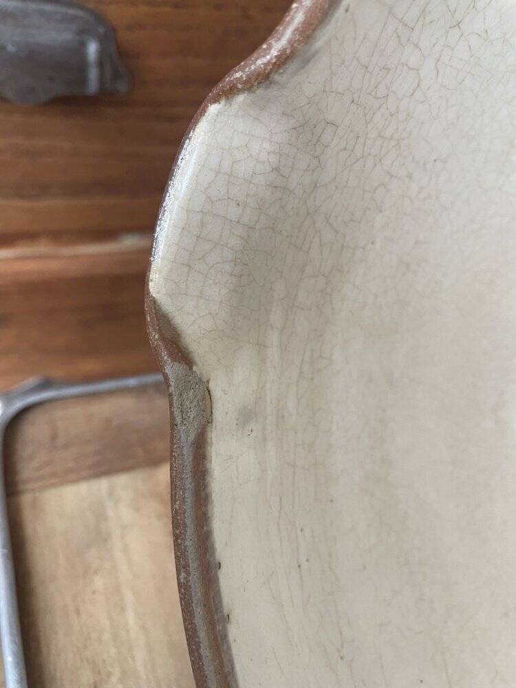 Antique spouted jug in terracotta