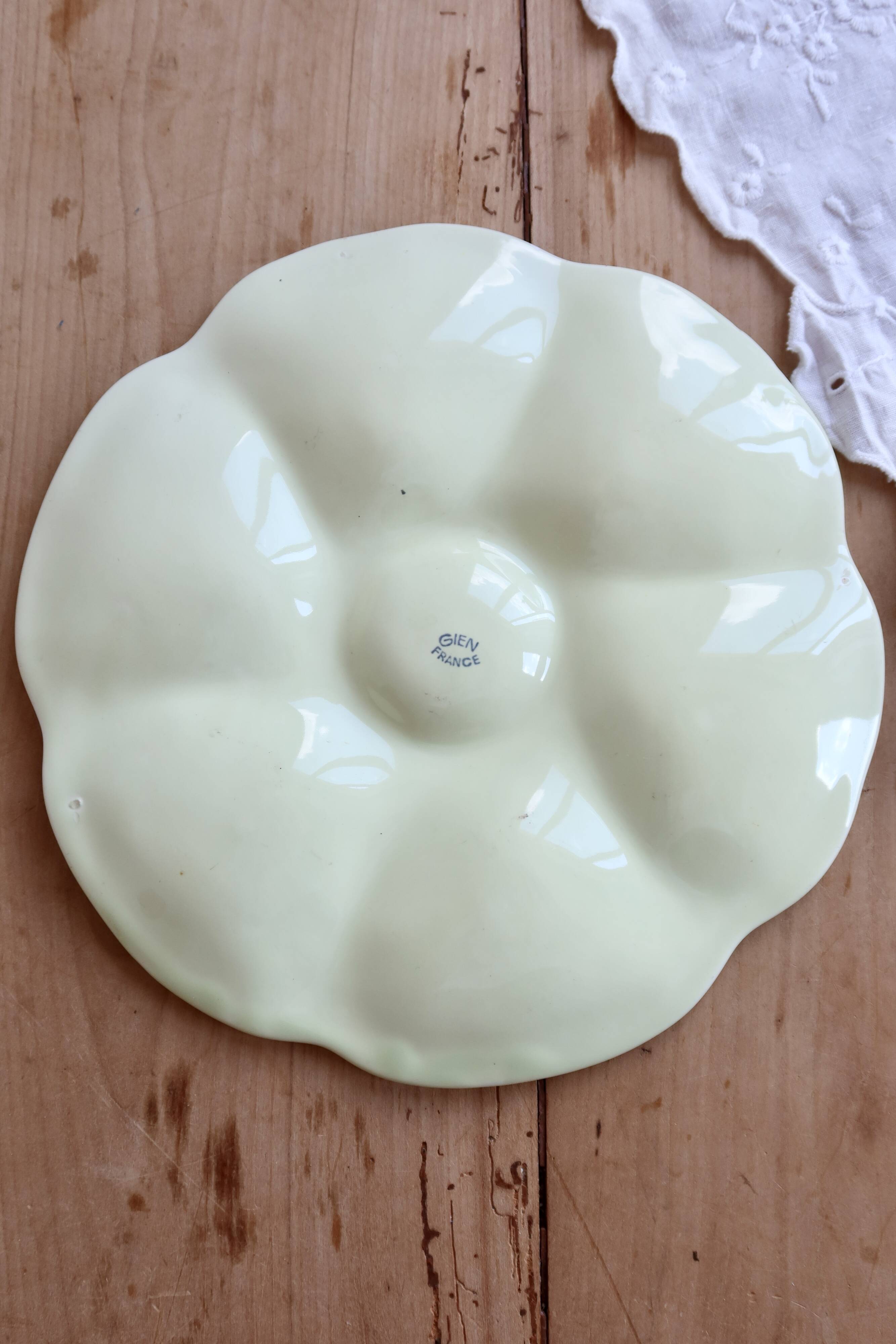 Vintage Gien oyster plate in almond green earthenware.