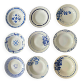 Set of 9 vintage deep plates with blue patterns.