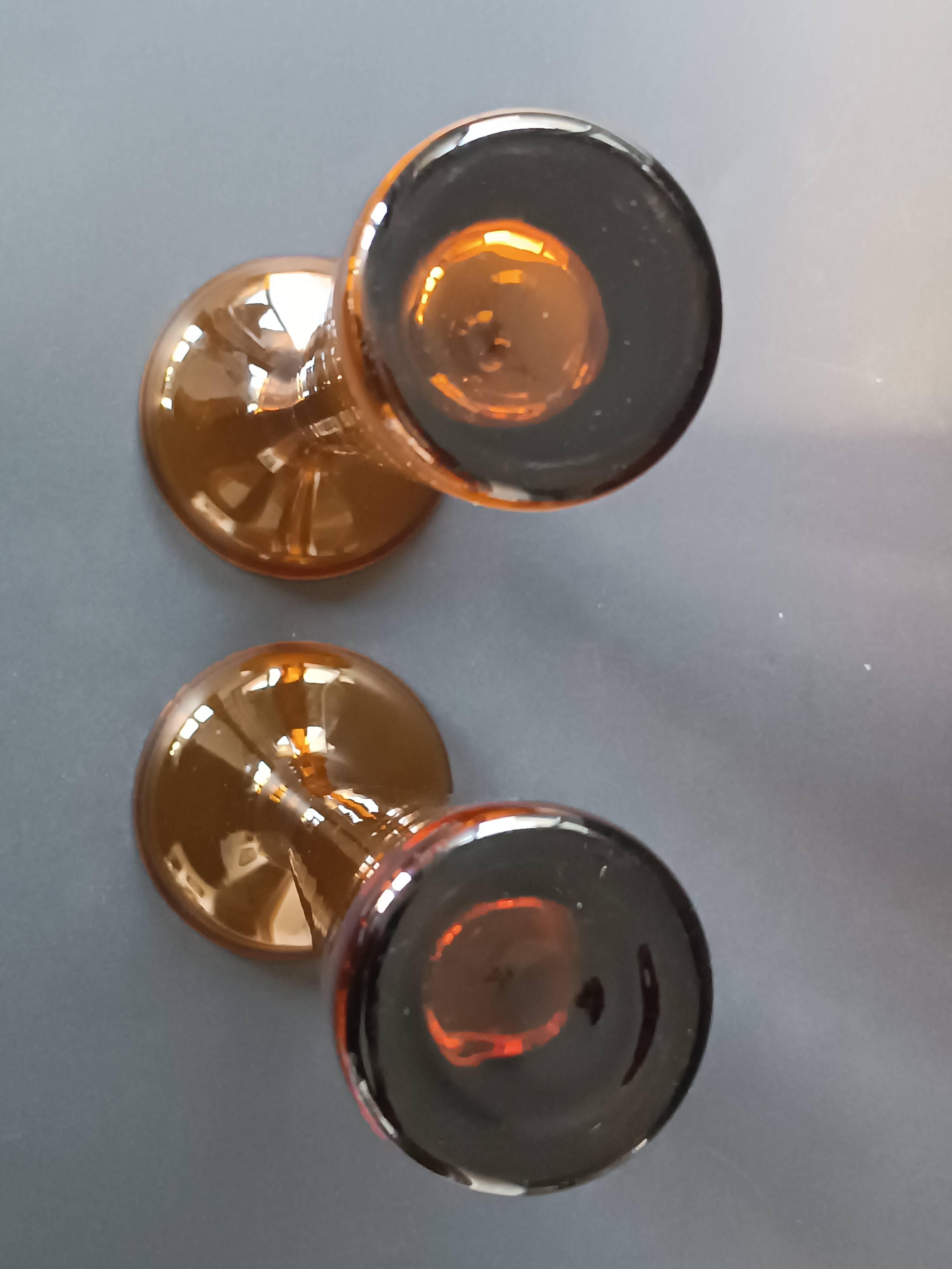 Two vintage Scandinavian double-layered amber blown glass candlesticks