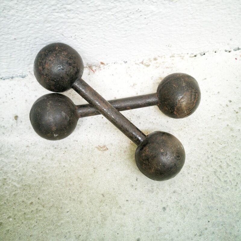 Pair of vintage cast iron dumbbells
