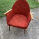Red fabric armchair in Mid-Century Scandinavian style, high back and light wood legs (1960s)