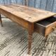 Antique cherry farmhouse table with 2 drawers and 1 pull-out