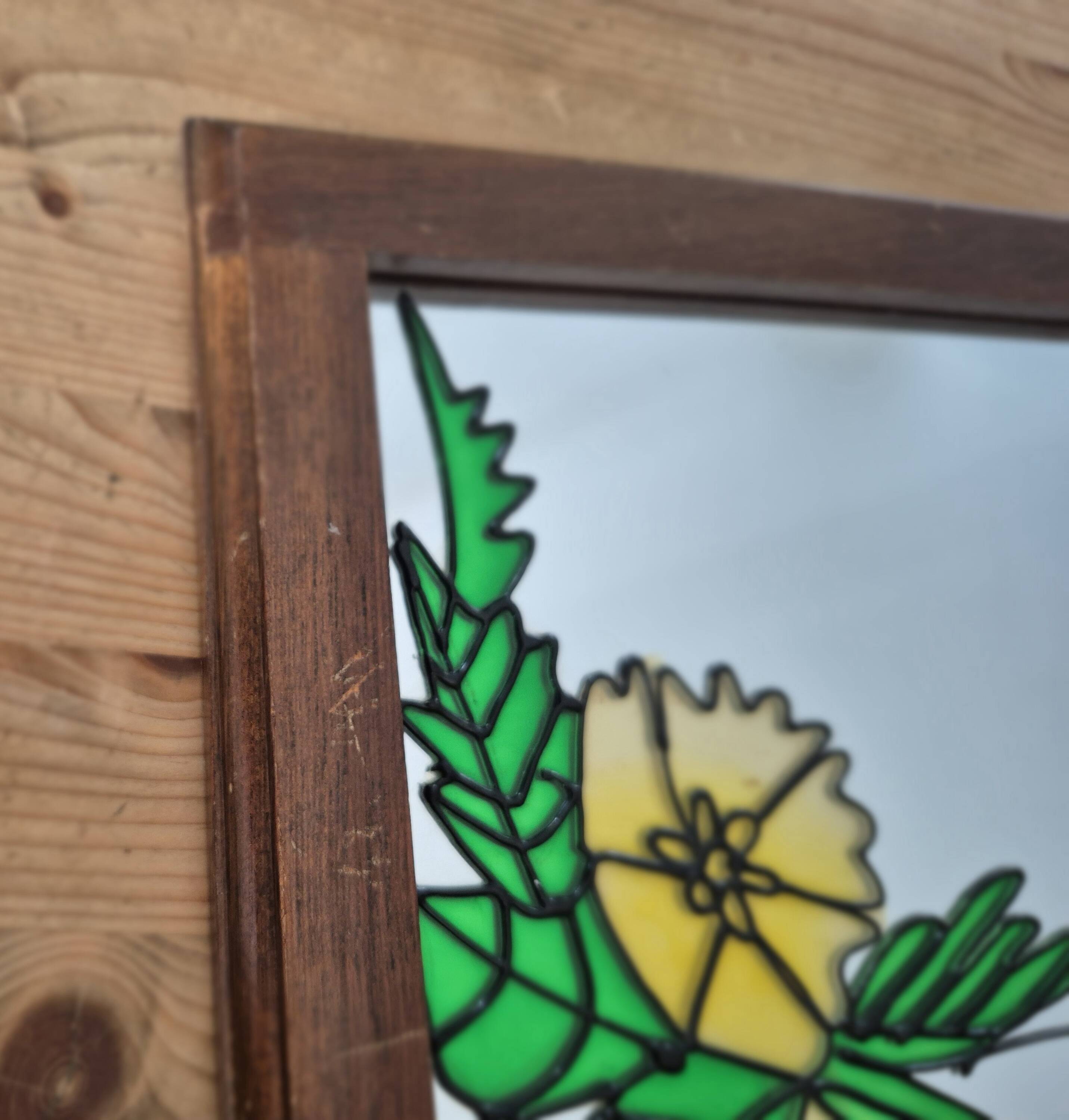 A pair of vintage stained glass style mirrors.