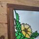 A pair of vintage stained glass style mirrors.