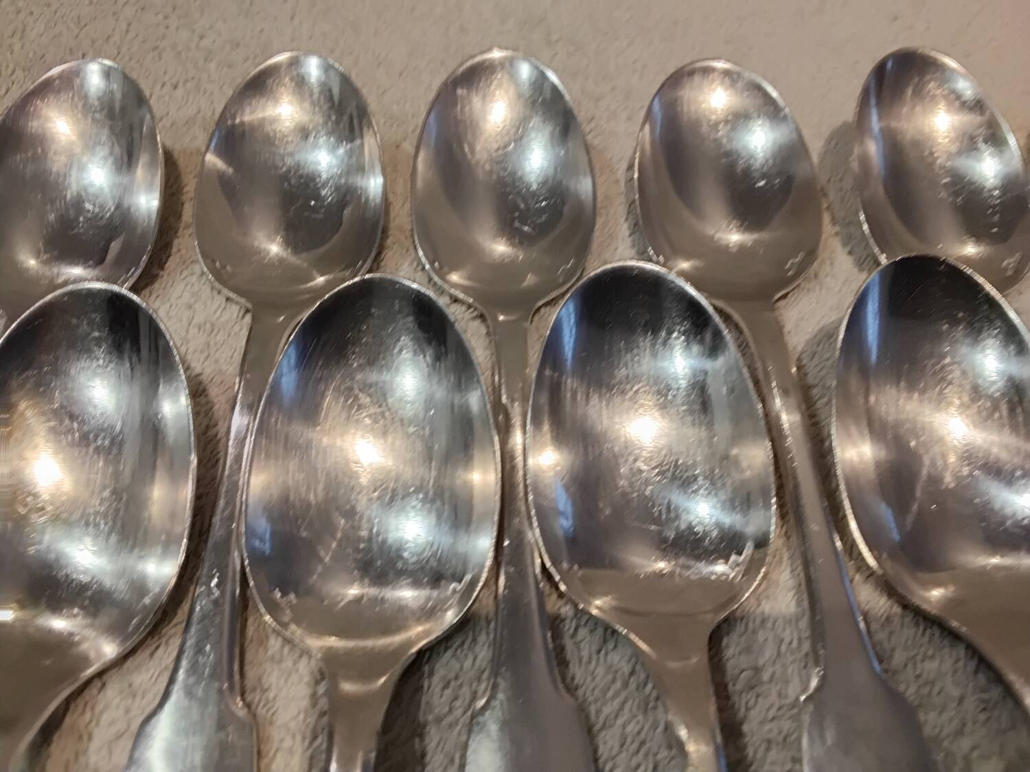 11 silver-plated dessert spoons by Christofle, Cluny pattern, striped