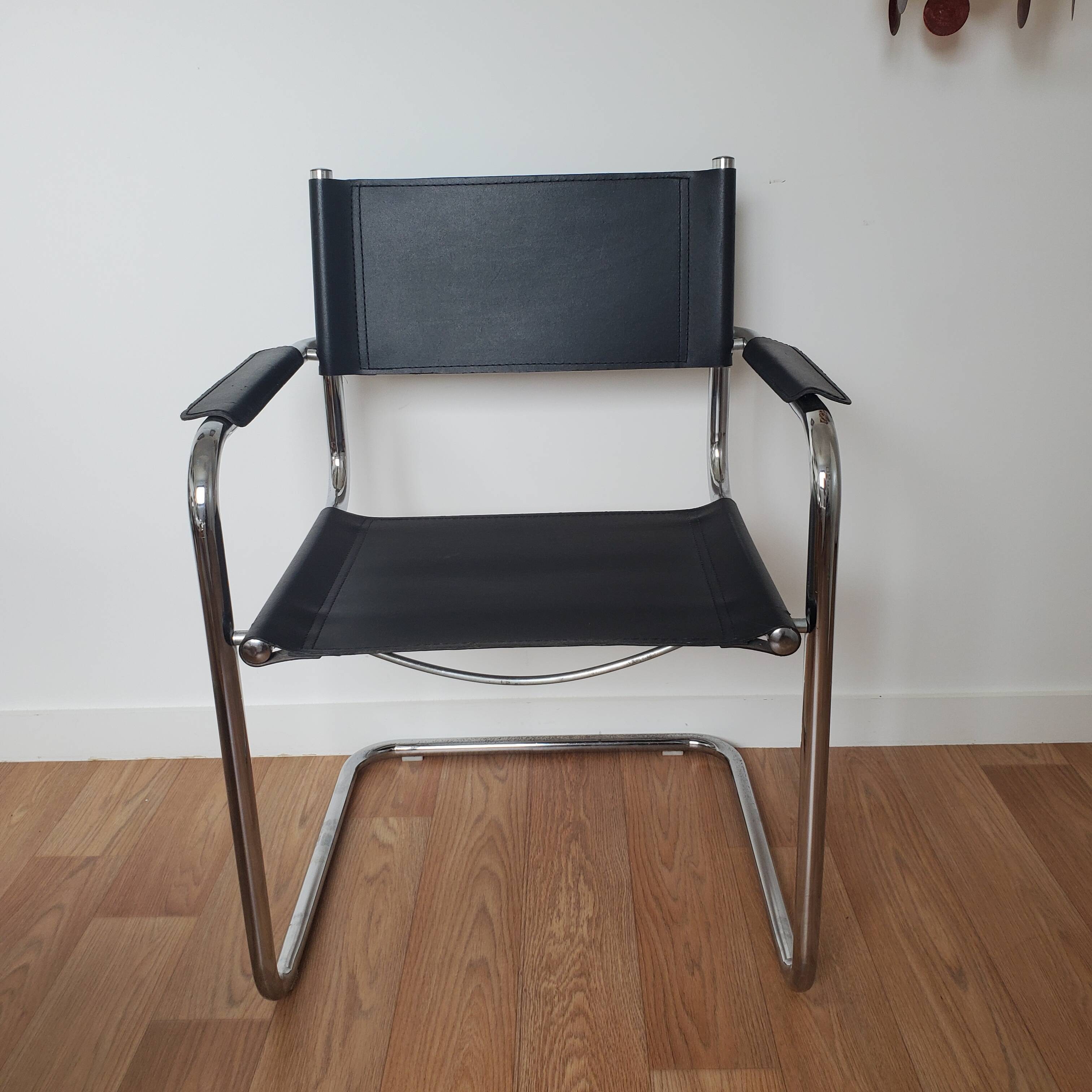 Pair of armchairs in chrome and black leather