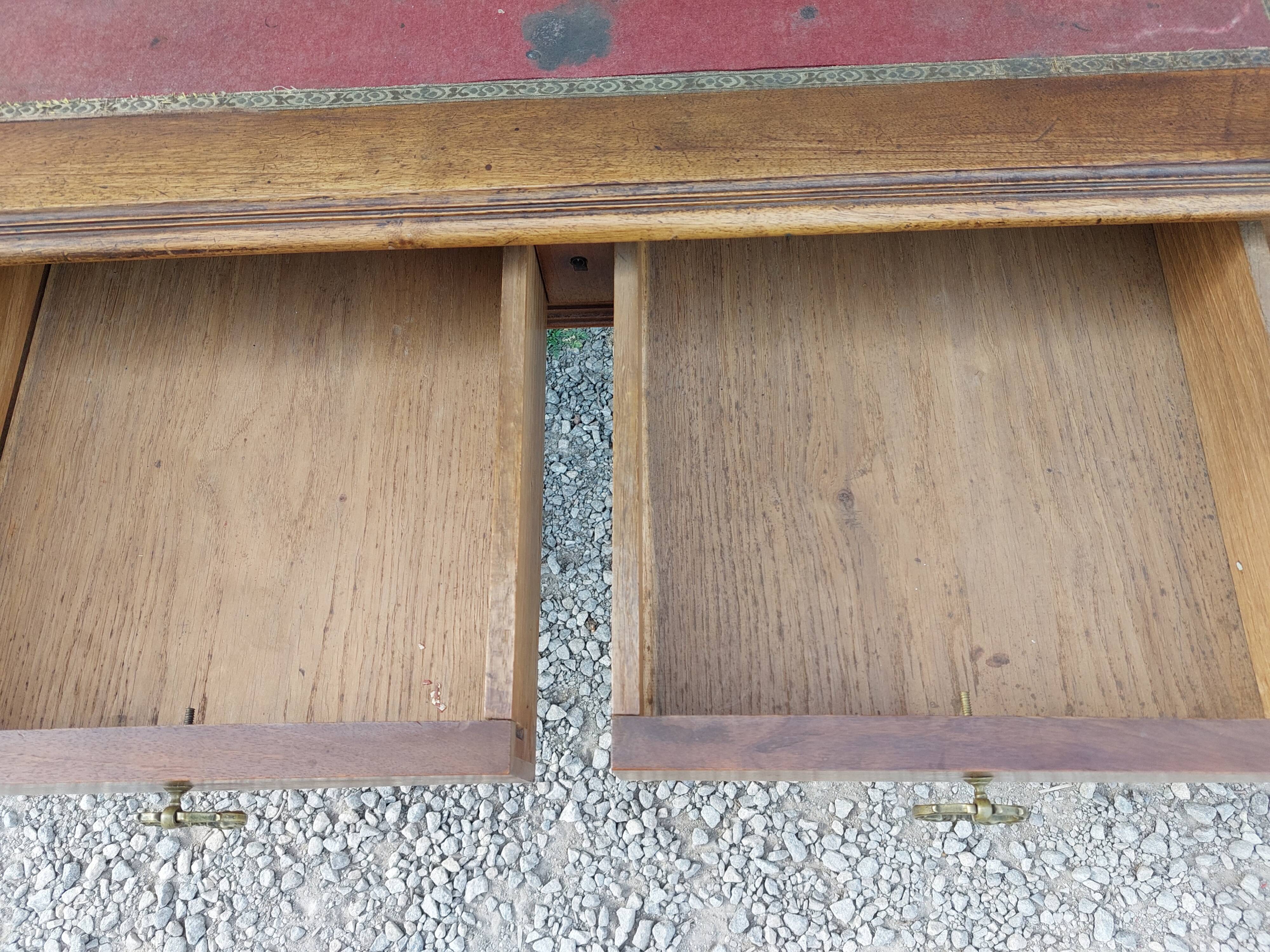 Old wooden desk, red felt top