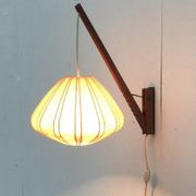 Mid-century pivoting wall lamp with a swing arm, Cocoon, made of teak wood, 1960s.