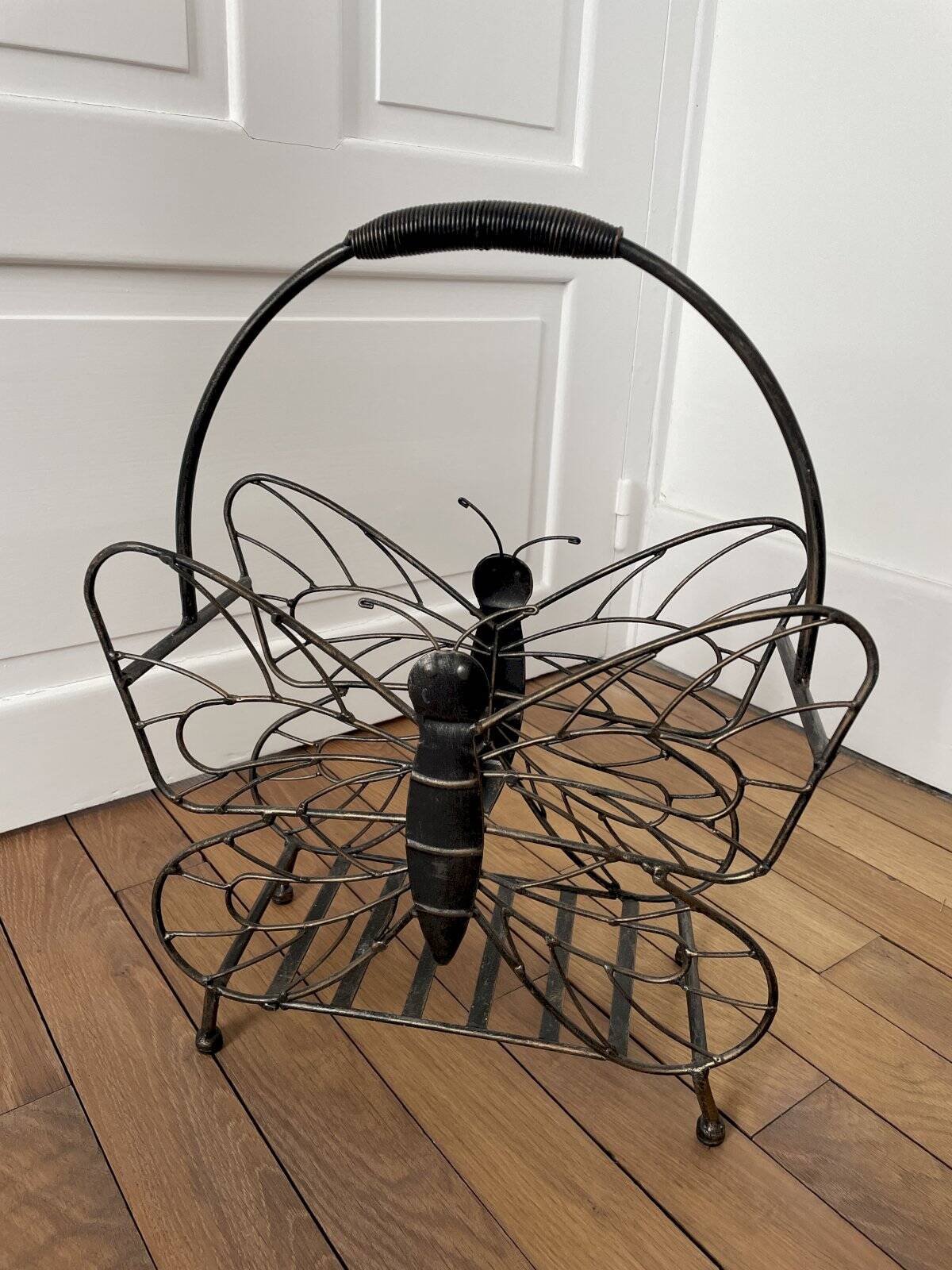 Butterfly magazine rack in patinated metal