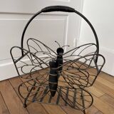 Butterfly magazine rack in patinated metal