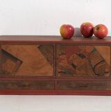 Small Japanese cabinet with sliding doors, Kabuki decoration, made of paulownia wood, early Showa period, circa 1926–1970.