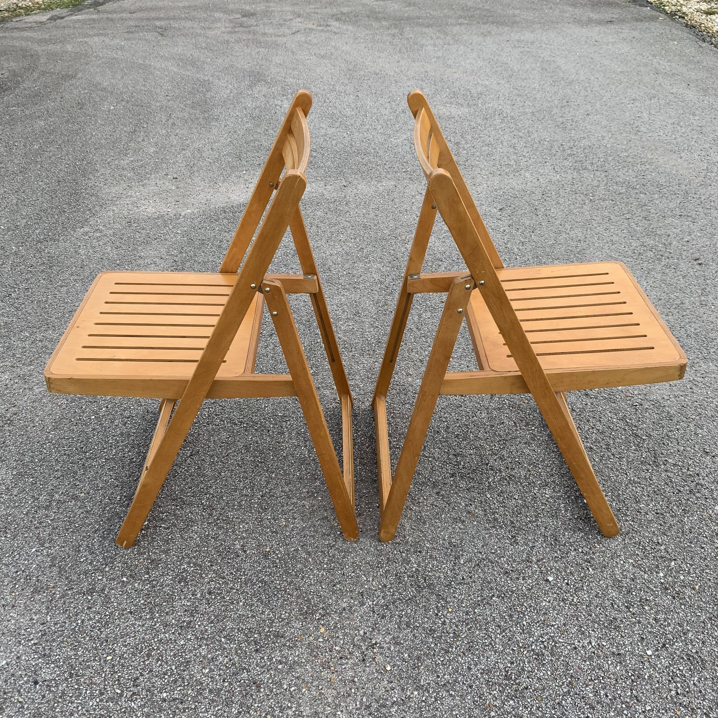 Pair of folding wooden chairs