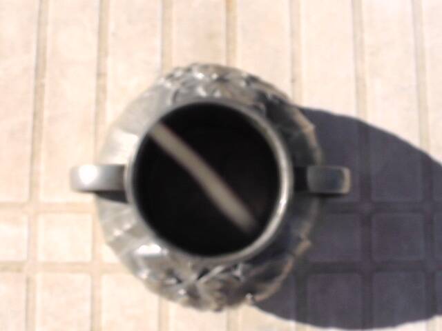 Pewter vase with vine decoration, 1930