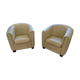 A pair of genuine leather club armchairs.