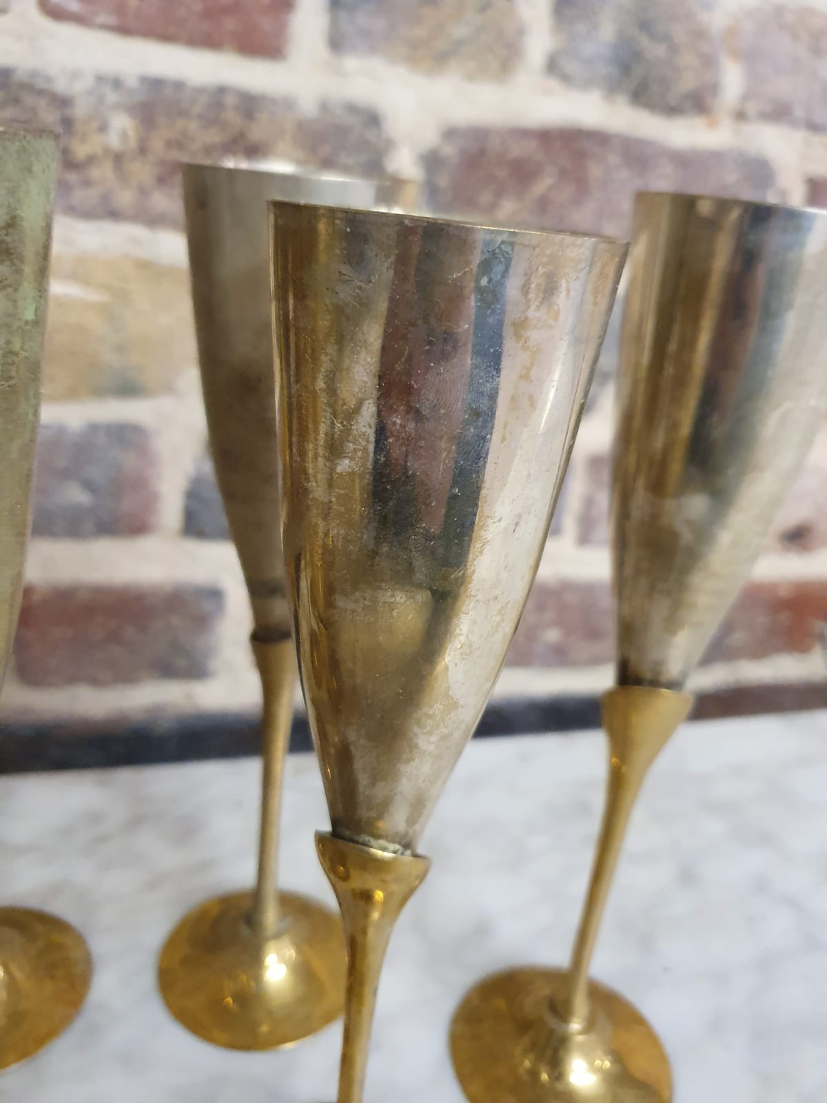 Lot of 11 brass champagne flutes