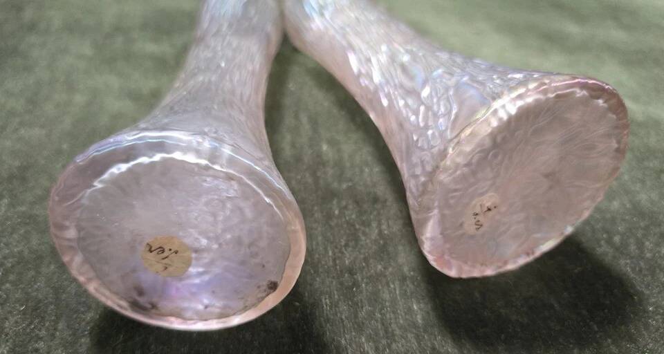 Pair of iridescent glass vases with relief decoration reminiscent of plant motifs.