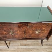Mid-century mahogany buffet with teal glass and compartments with a drawer.