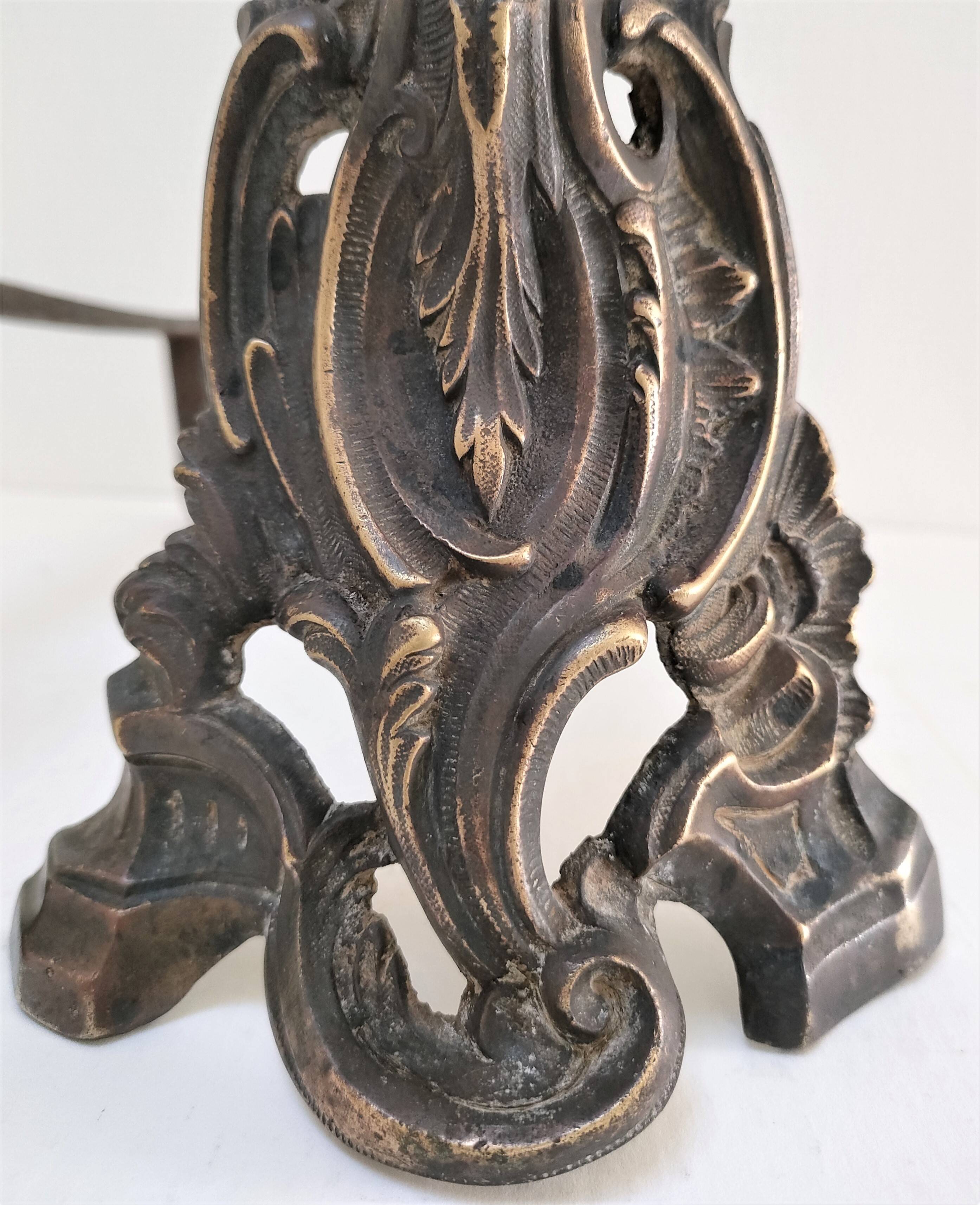 Pair of bronze andirons with black patina, 19th century, female caryatids