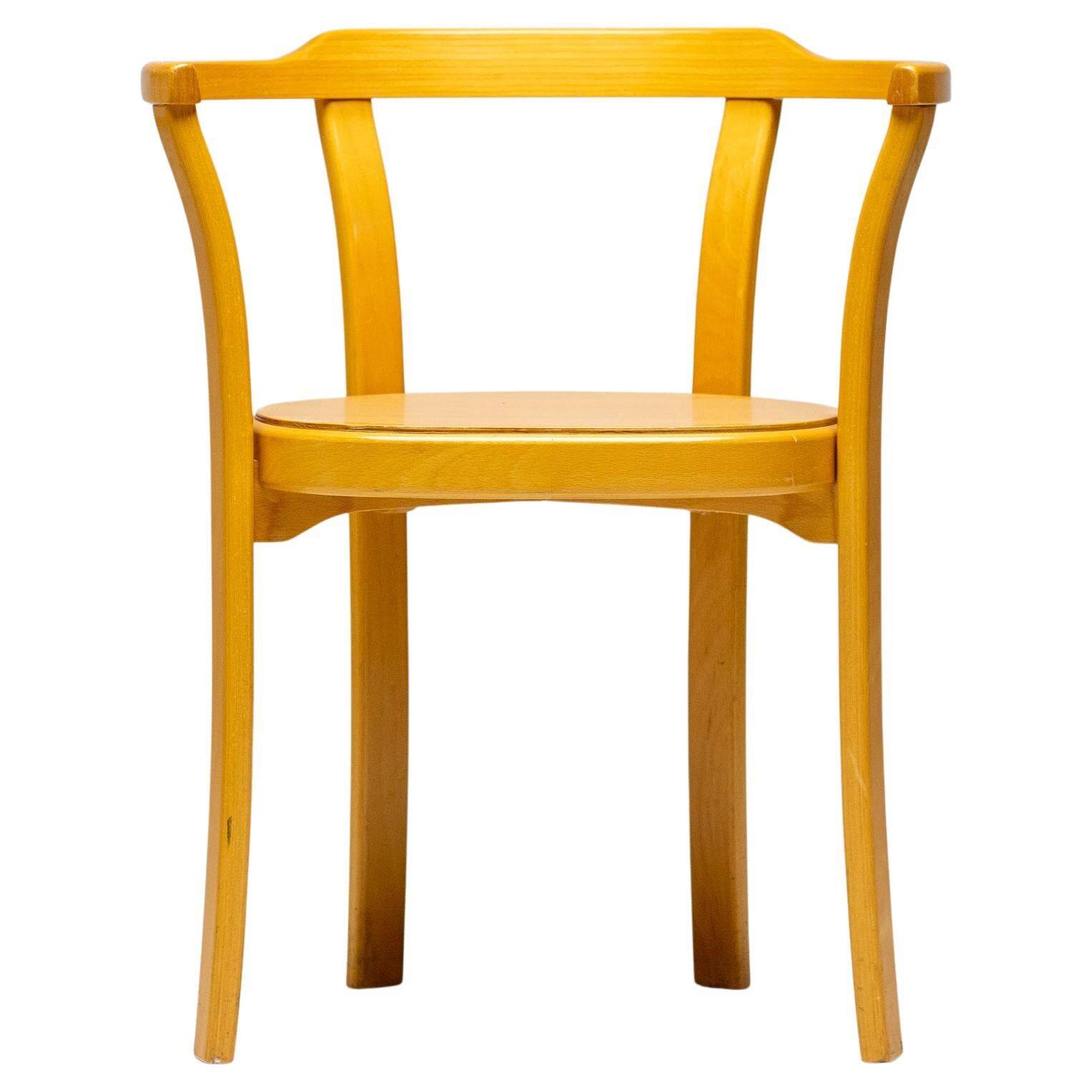 Stackable chairs in curved beech.