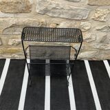 Black perforated metal magazine rack