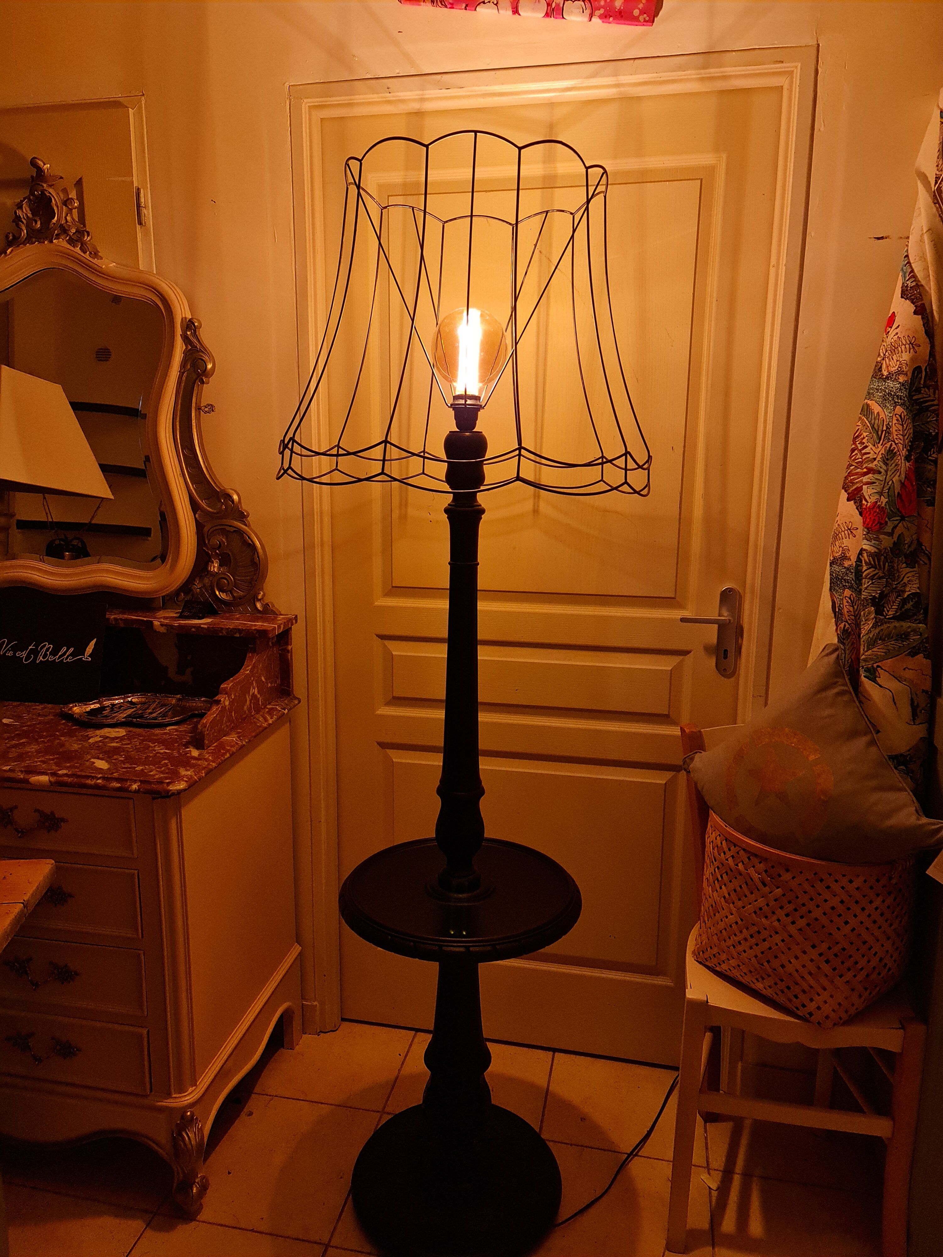 Matte black lamppost with small tablet