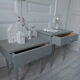 Duo of bedside tables, mismatched vintage sofa ends green of gray