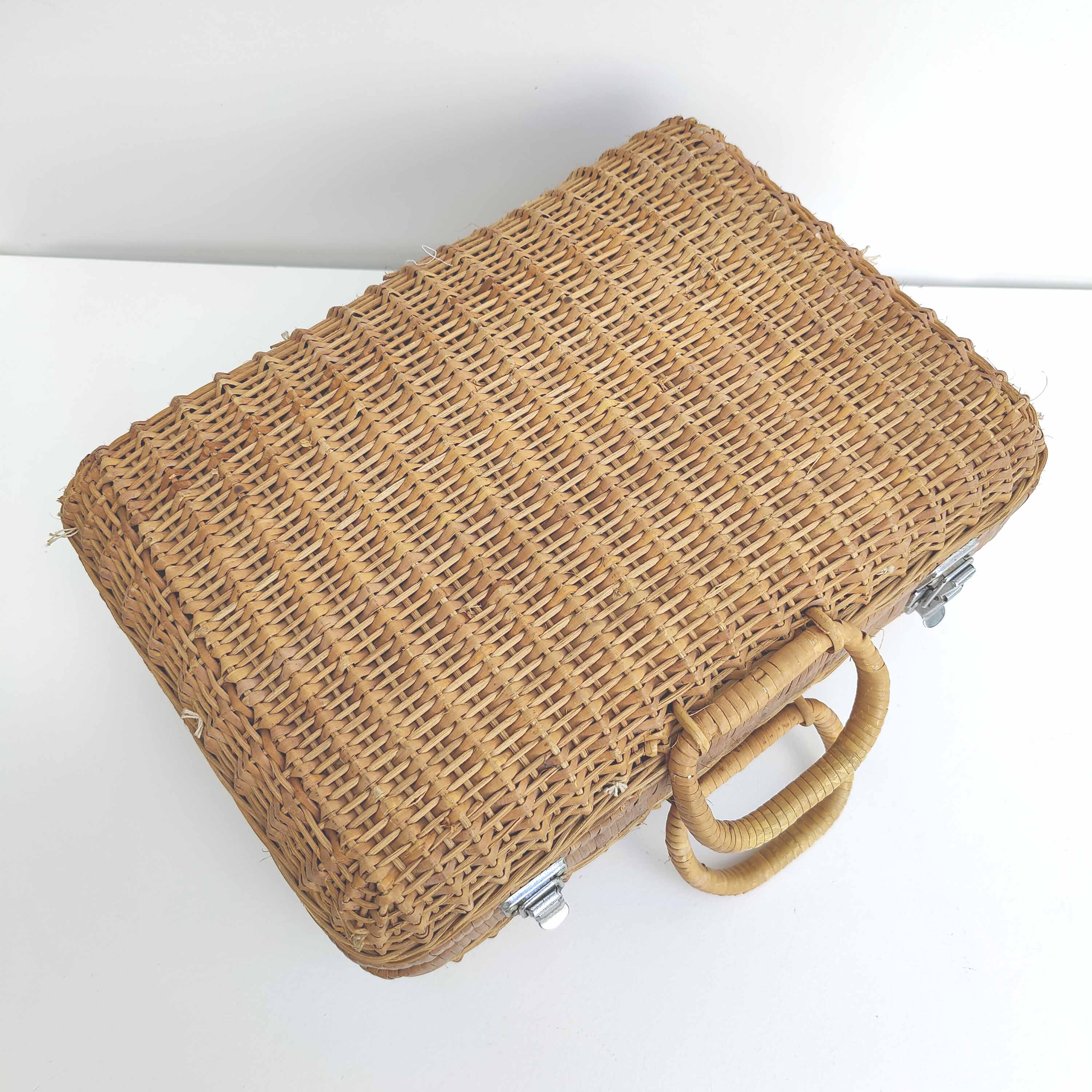 Rattan suitcase and wicker interior flowered